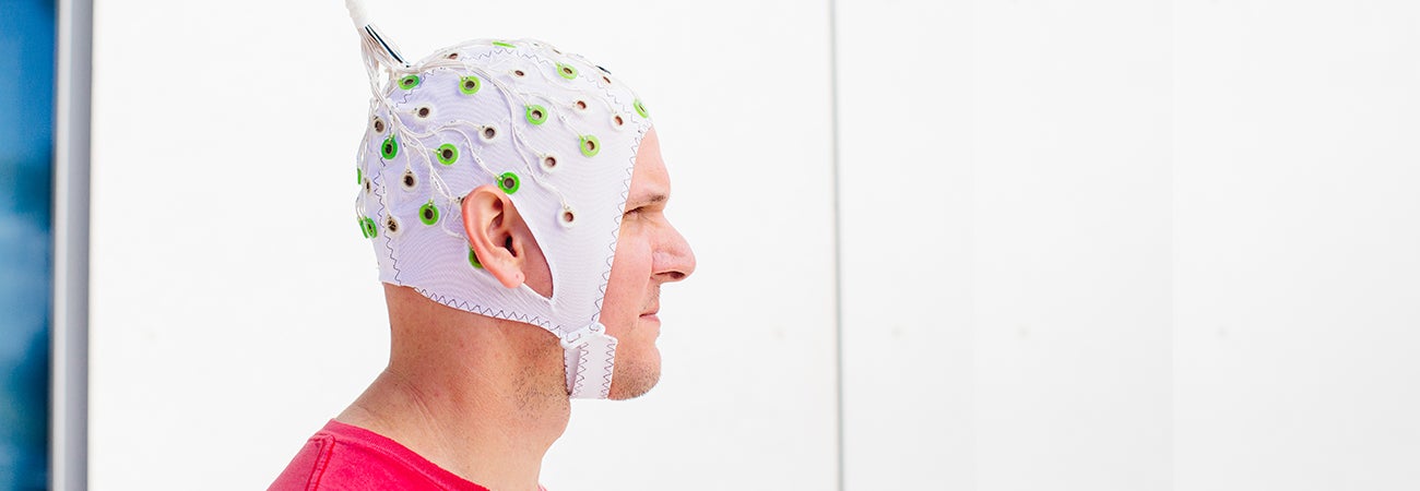 Man wearing neruo helmet for research