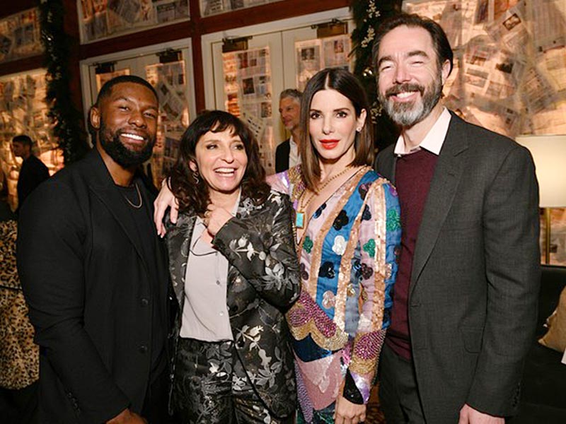 Chris Morgan with three cast members, including Sandra Bullock.