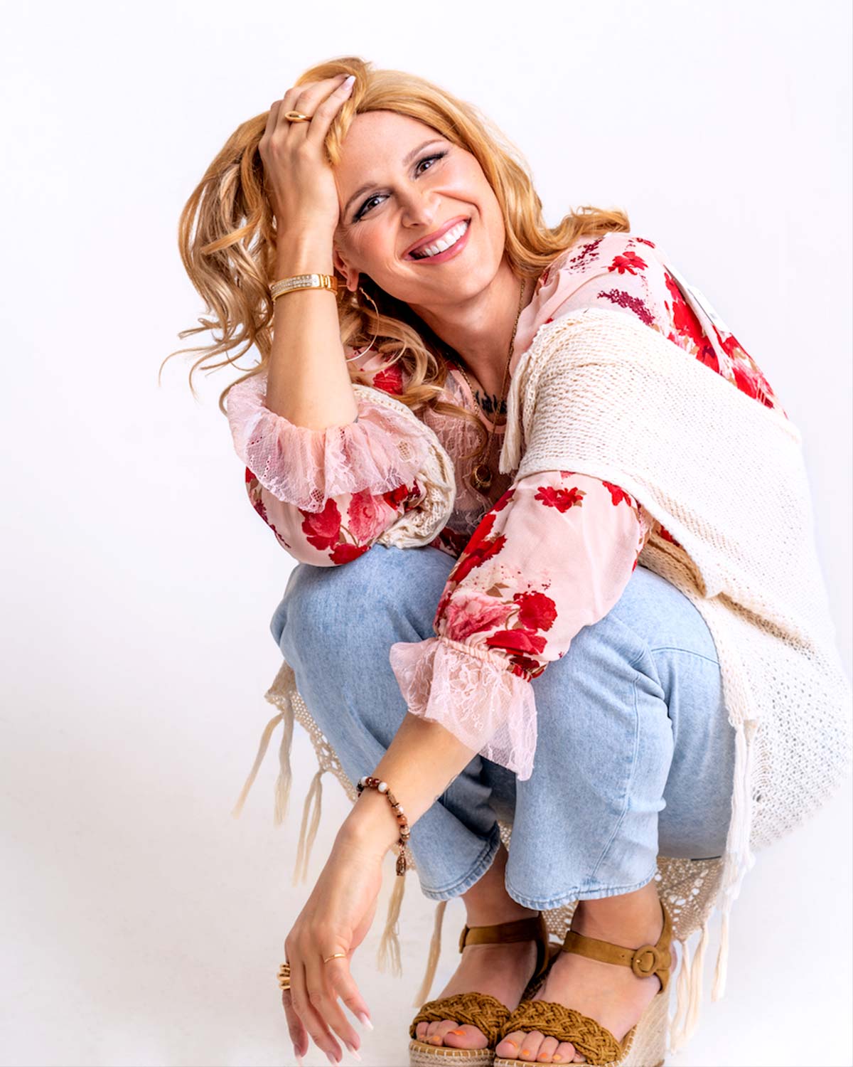 Shakina Nayfack poses in front of a white background.