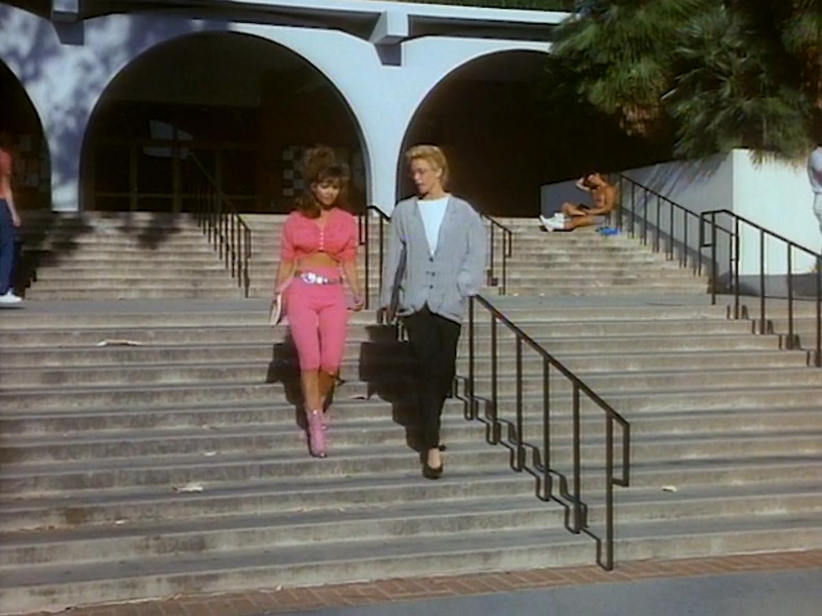 Still from the movie 'Cannibal Women in the Avocado Jungle of Death', with Dr. Hunt and Bunny on the steps of Olmsted Hall.