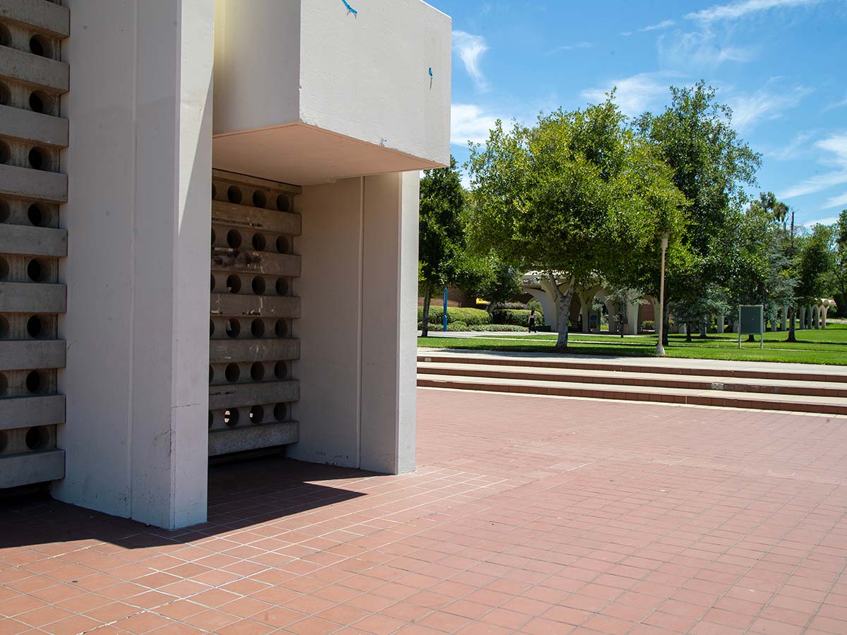 View of the Bell Tower base, facing the trees in front of Rivera Library.