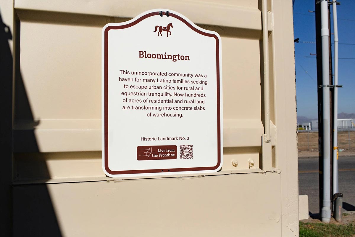 Signage for Historic Landmark No. 3 acknowledges community history.