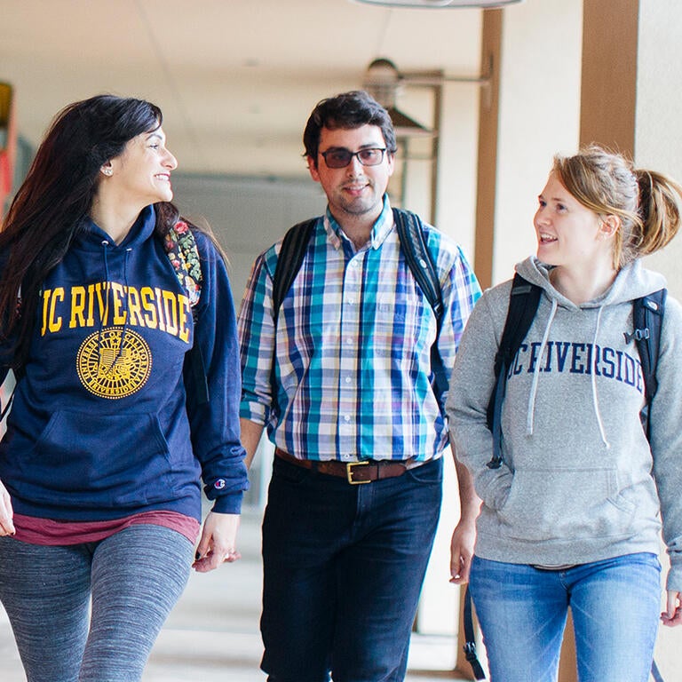 Students walking and smiling