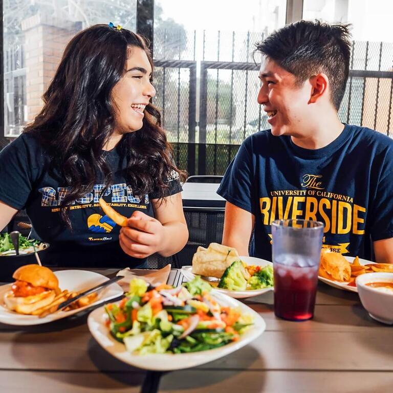 UCR Student eating on campus