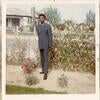 Edmund Greene in his family’s flower garden on the corner of Norman Rd. in Valley Truck Farms.