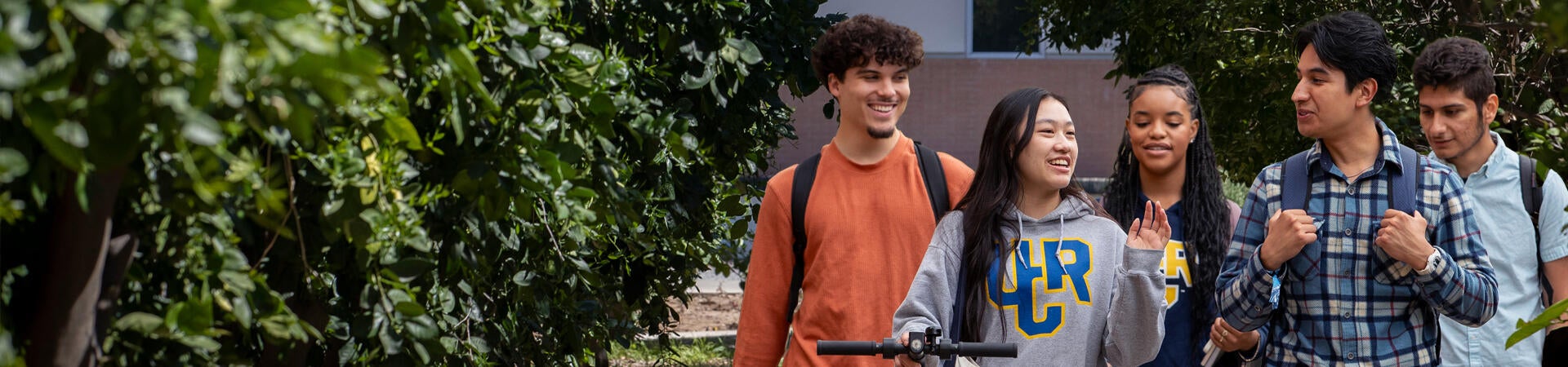 Group of UCR students walking on campus