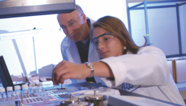 Professor and student in research lab